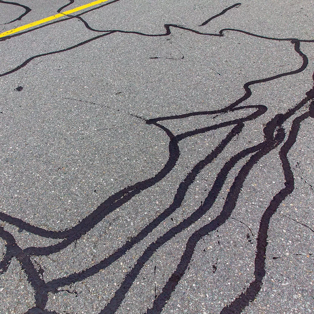 Repaired Cracks In An Asphalt Road